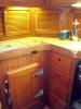 Galley showing refer top and front access, cutting board & drawers